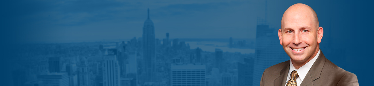 Richard K. Hellerman with the New York Skyline in the background